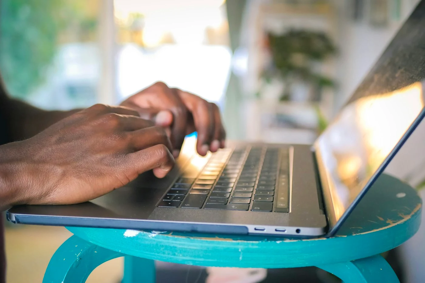Hands using a laptop